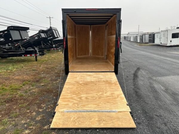 2025-HOMESTEADER-6X12-ENCLOSED-CARGO-TRAILER-RAMP-DOOR-BLACK-TRIM-7.jpg Homesteader 6 x 12 V-Nose Enclosed Trailer – Black Trim